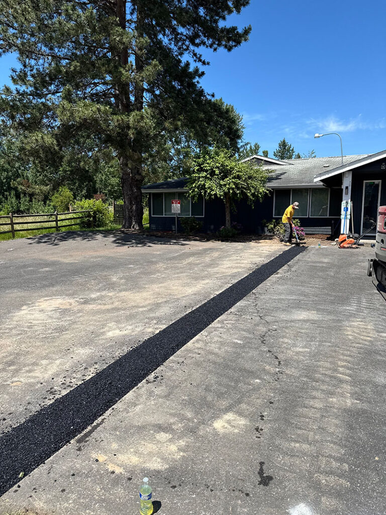 finalization of a french drain installation project involving concrete cutting of a driveway with franky's excavation